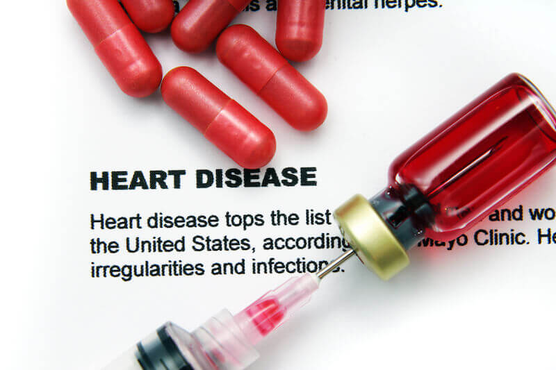 medication for sick hearts showing pills and an injection