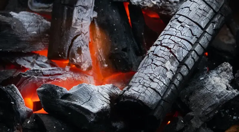 The love of many shall wax cold showing burning charcoal
