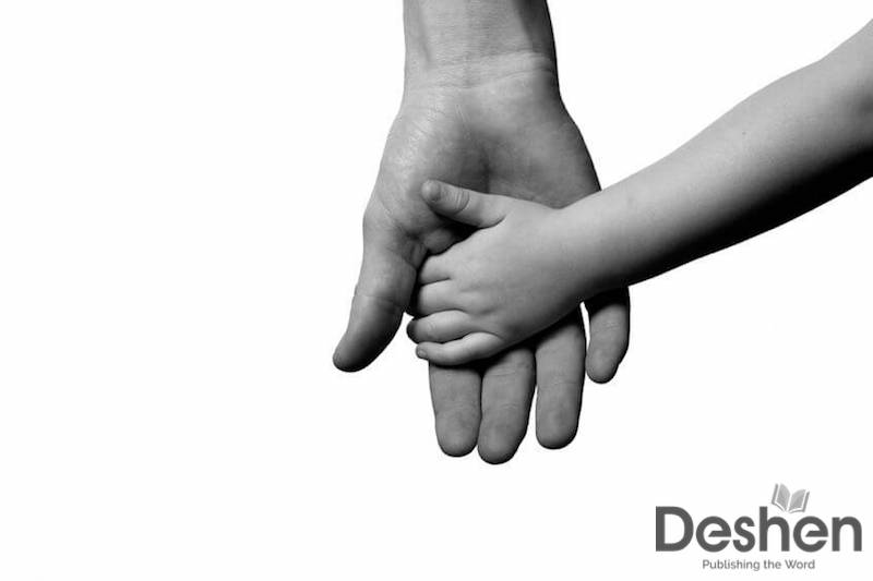 Abba, Father images sowing a man's hand holding a child