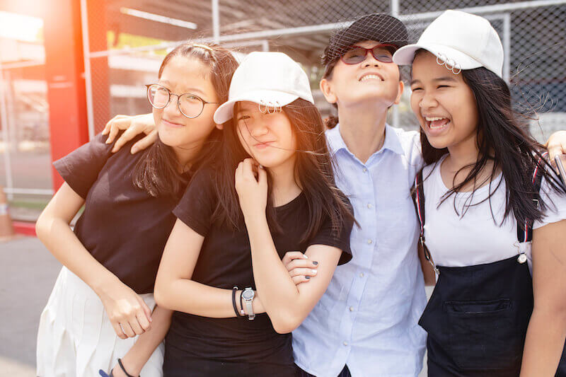 acceptable year showing a group of asian girls and their mother