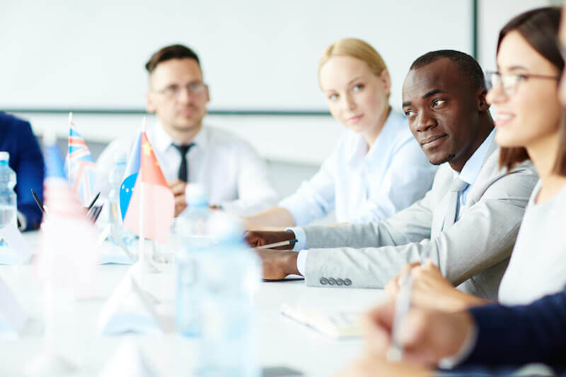 Attend unto my words showing a group that is looking at a speaker