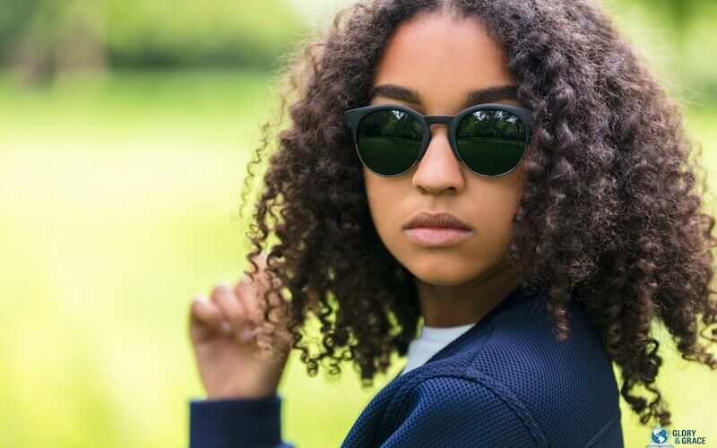 Altitude determines altitude showing a young woman with sun shades