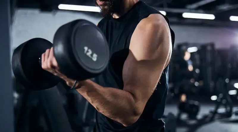 be strong in the grace that is in Christ Jesus showing a man in the gyn building muscles