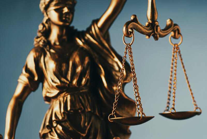 justified freely by his grace showing the a justice balance