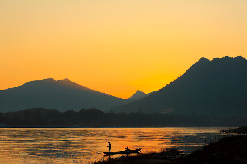 believing is receiving showing a river with a man in a boat