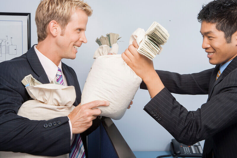 beware of covetousness showing a man holding a bag of money
