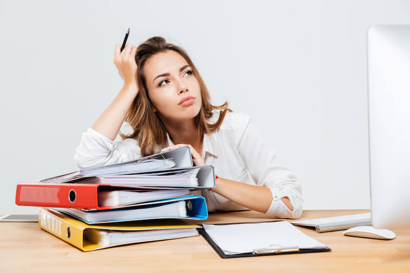 biblical psychology showing a woman with many books on her desk