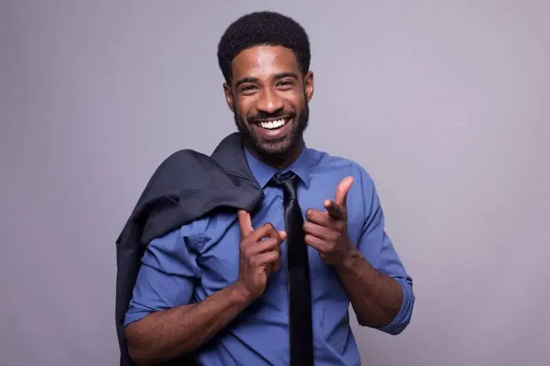 by the grace of God i am what i am showing a happy black man
