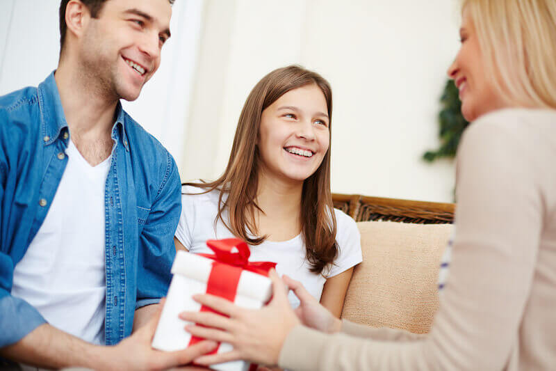 cheerful giving showing a woman giving a gift cheerfully