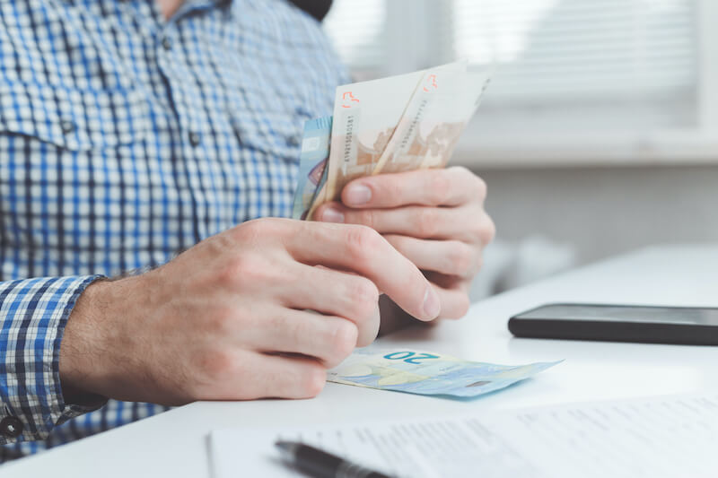 trust cost of grace showing a businessman calculating expenses