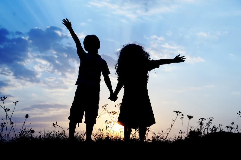 created to fellowship with God showing a young boy and girl holding hands