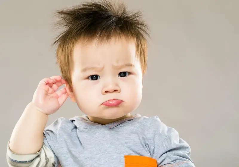 Demystifying faith showing an asian confused baby