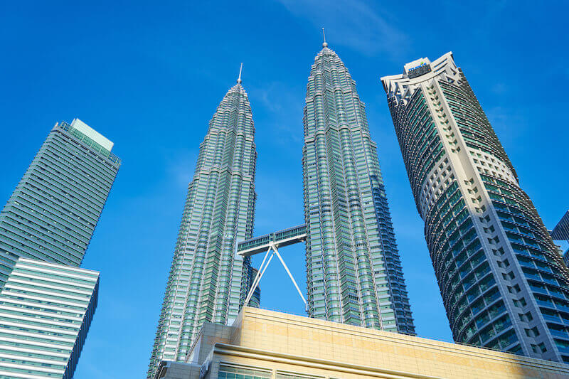 Far above all principalities showing two tall buildings