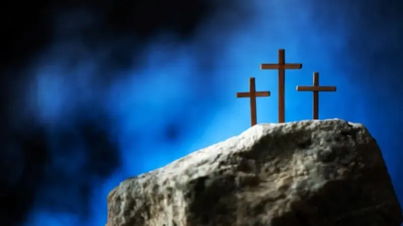 Golgotha, a place of a skull showing three crosses on a hill