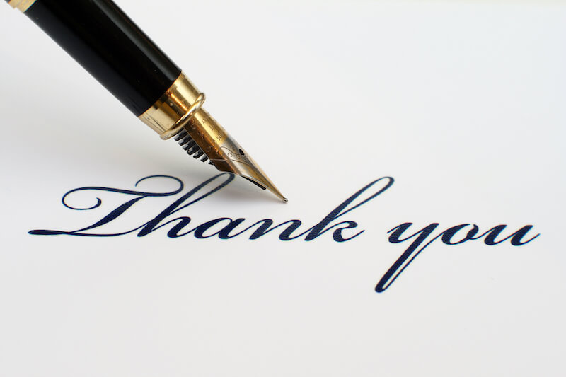 Good thing to give thanks showing a pen writing thank you