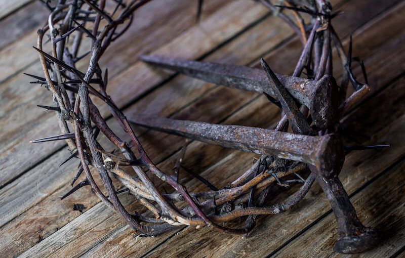 he was wounded for our transgressions showing crown of thorns and nails