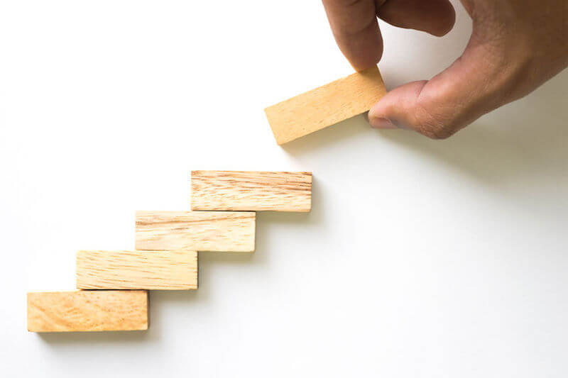 Showing blocks one upon another to illustrated higher levels of glory