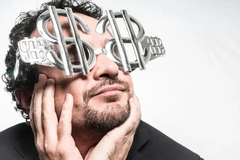 love of money root of all kinds o problems showing a man with money in his eyes