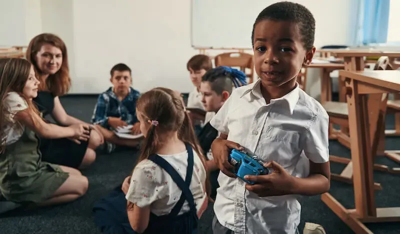 love is patient love is kind showing a child in class