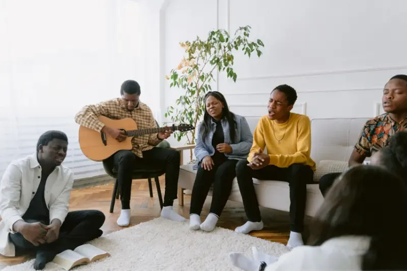 make a joyful noise showing a group singing praises