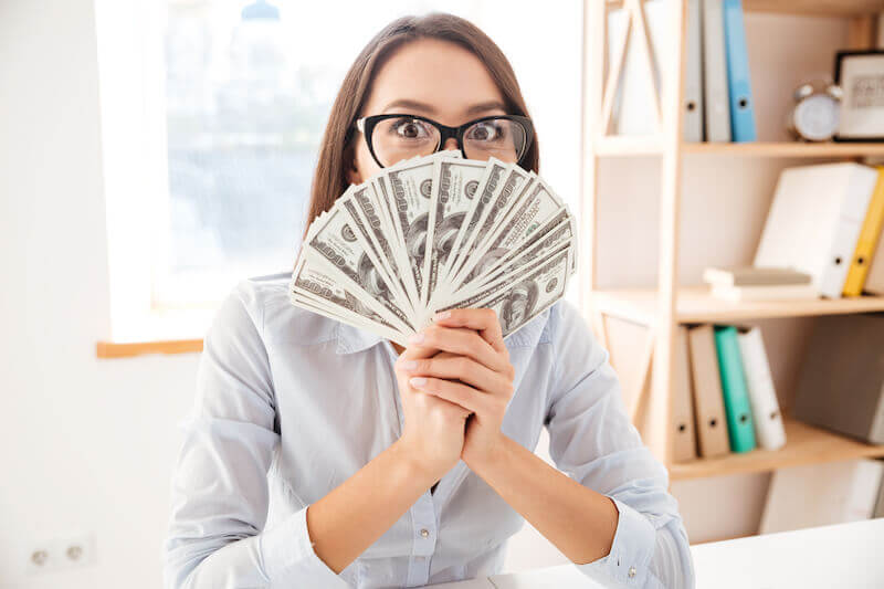 make your way prosperous showing a woman holding money