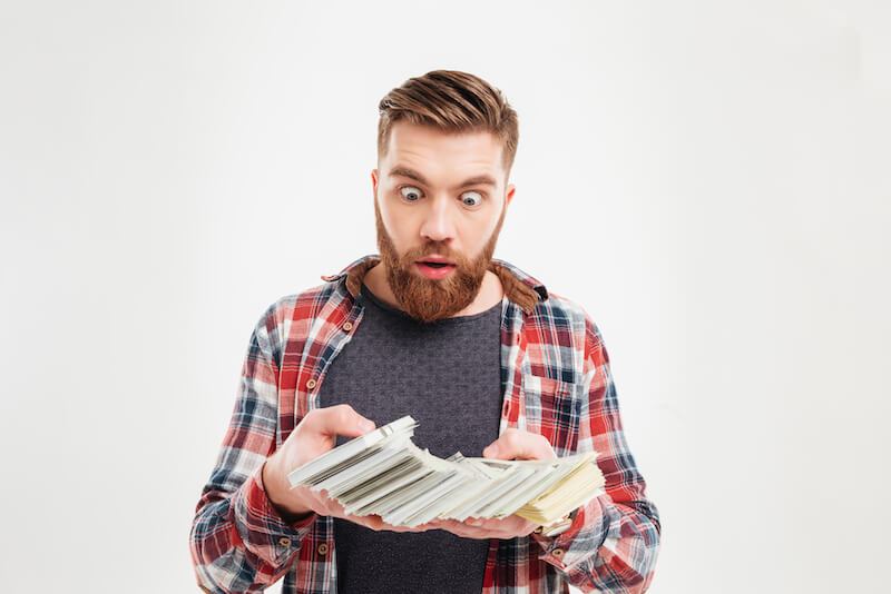 open thou mine eyes showing a man looking at money