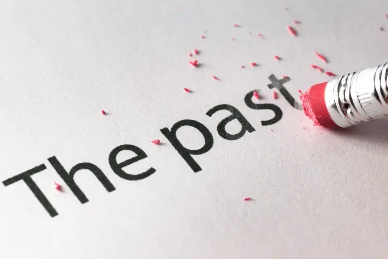 letting go of the past showing an eraser wiping the past
