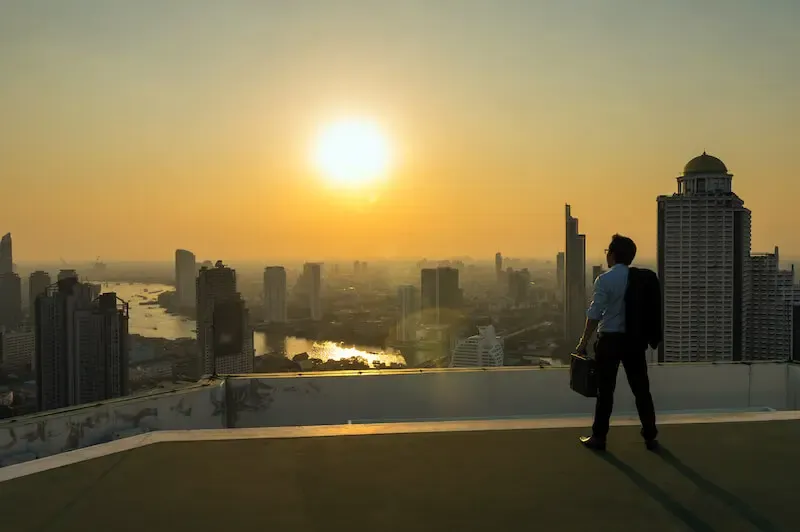 man looking at the sunset