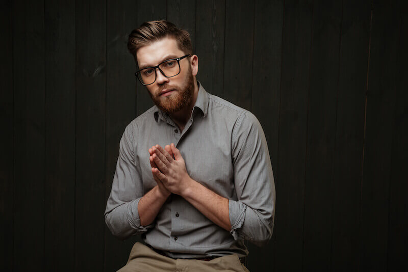 speaking in tongues mysteries showing a man with hands in prayer