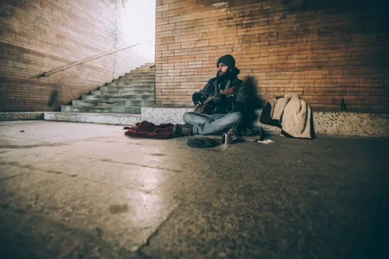 the prodigal son coming to himself showing a man sitting alone