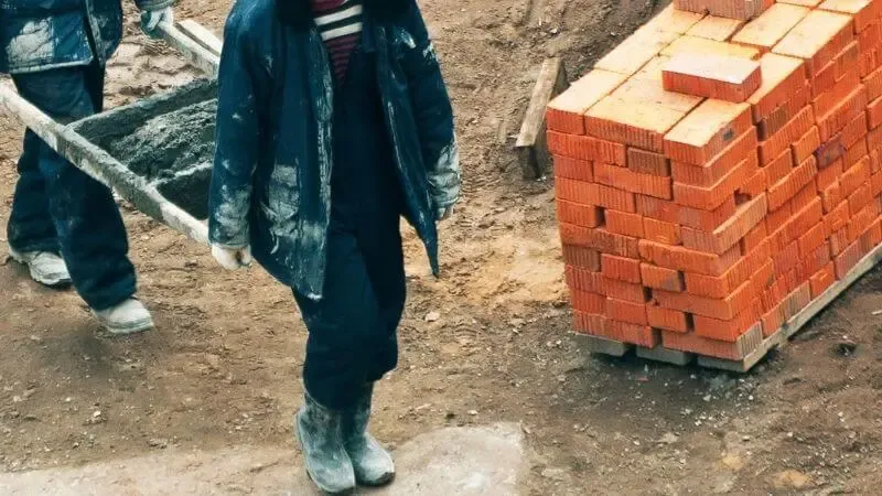 The rejected stone became the head of the corner showing a group fo builders