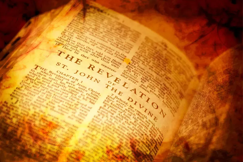 Revelation 13 showing an open page of the book of revelation