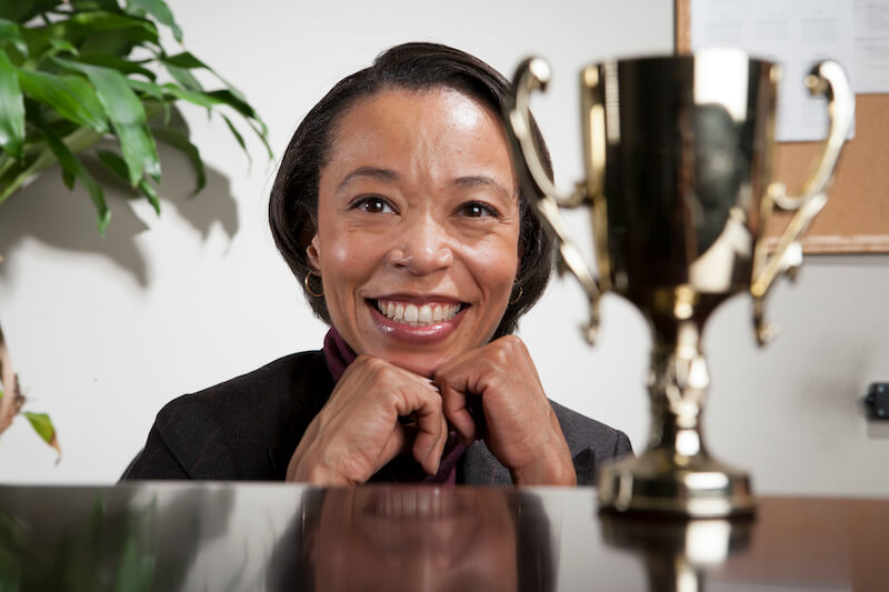 give to every man according to his works showing a black woman with a trophy