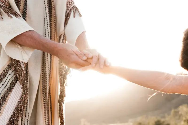 seeing Jesus showing a man holding Jesus' hands