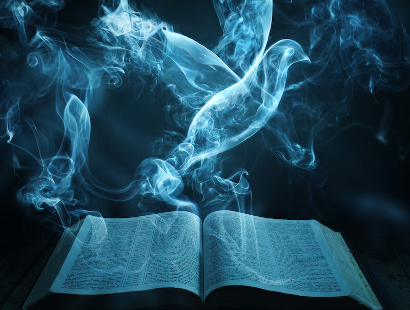 The Spirit of God moved upon the face of the waters showing a dove hovering over the Bible