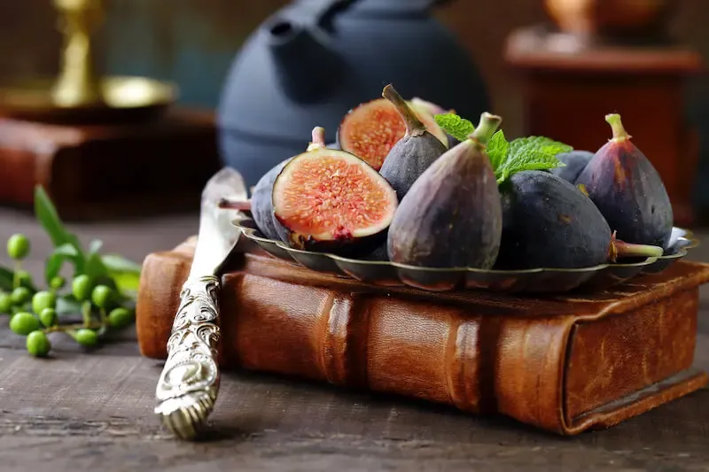 physical and spiritual well-being showing fruits on a book