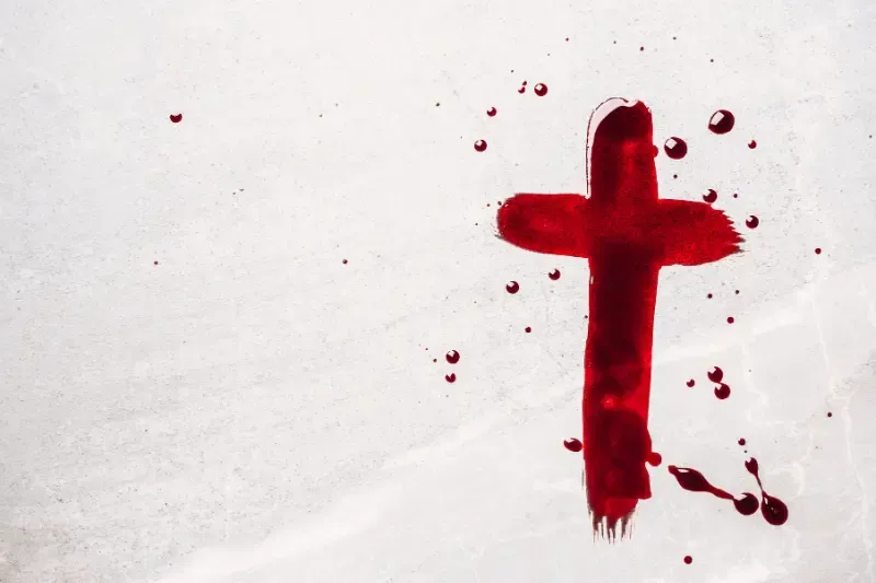 The sprinkling of the blood of Jesus showing blood tracing a cross