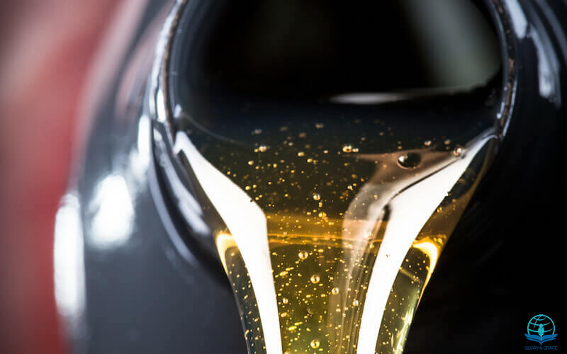 The anointing showing oil being poured from a container