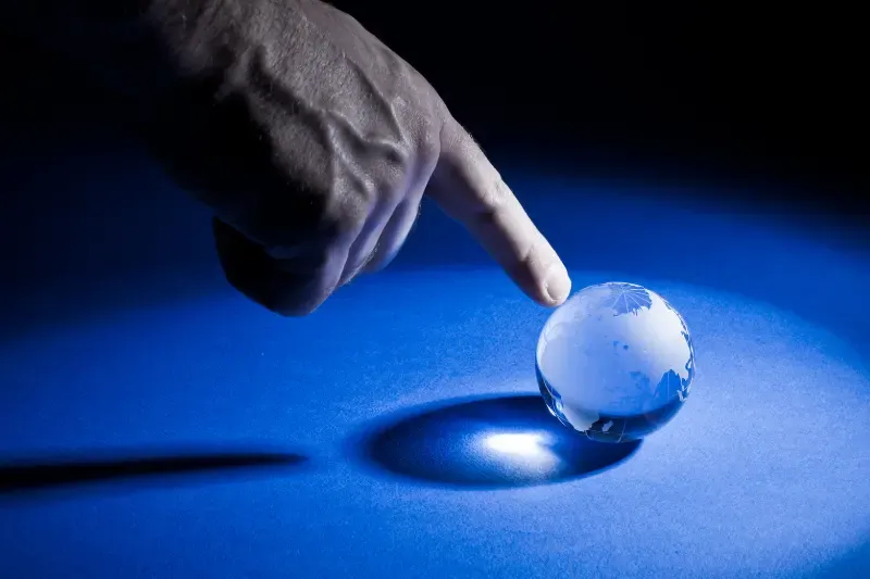This is the finger of God showing a finger pointing at th globe