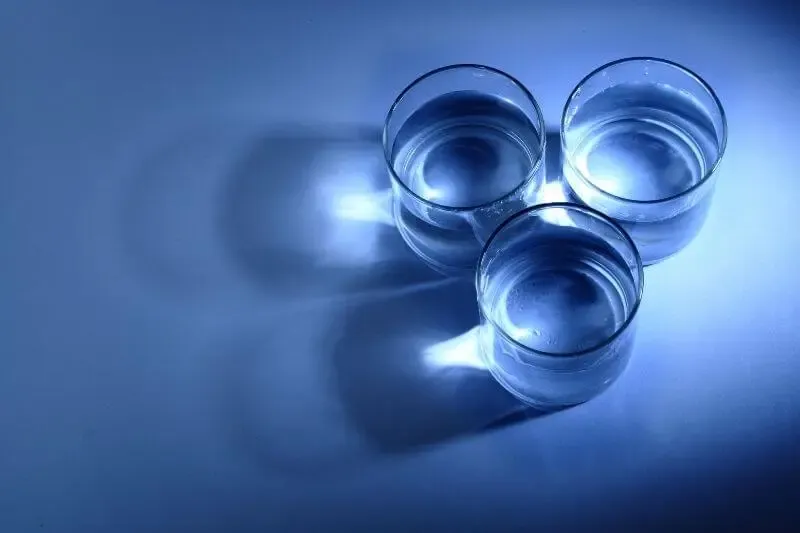 three facets filled with the spirit showing three glasses of water