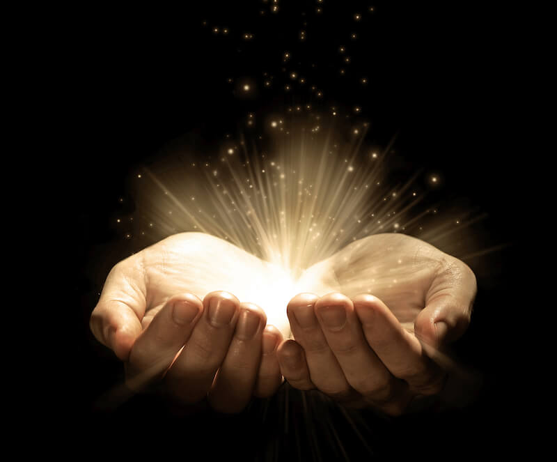 two hands holding light
