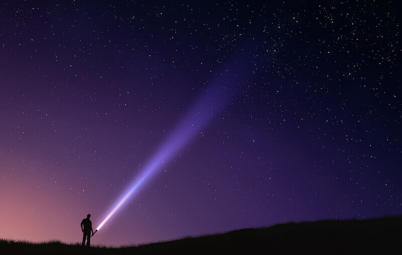 Two laws showing a man with a light