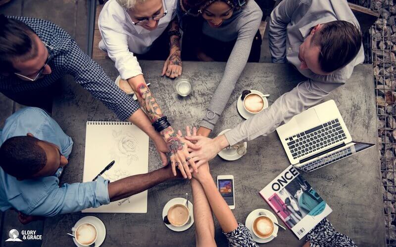Unity of the Spirit image showing many people holding hands together