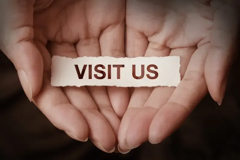 He has visited and redeemed his people showing a hand with text visit us