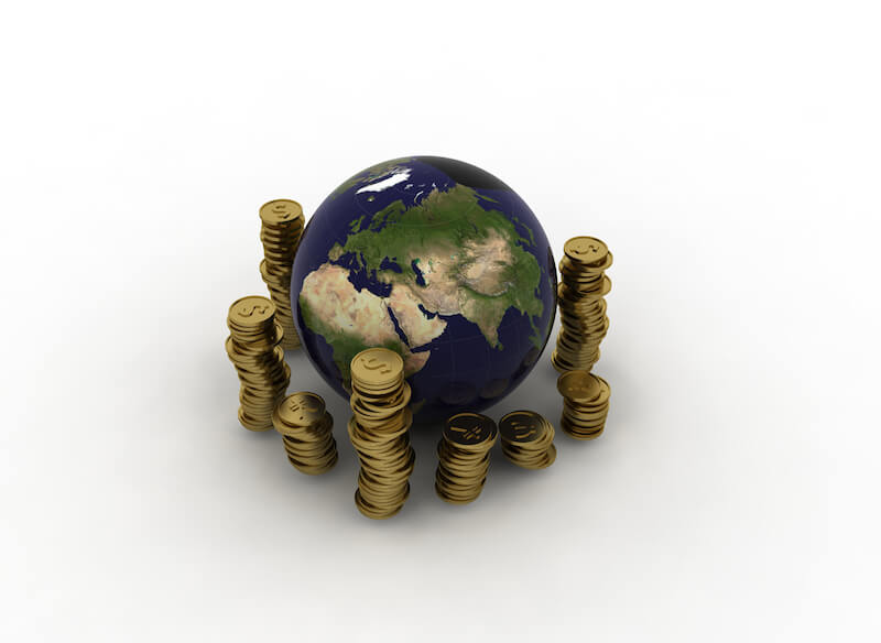 Spiritual riches showing coins around the earth