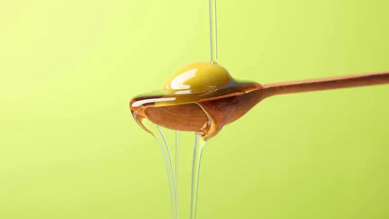 abundant life showing oil overflowing from a spoon