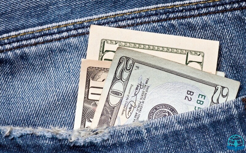 What is money showing dollars in someone's pocket