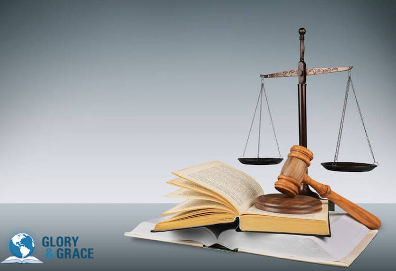 What is the law? Image showing a pair of balances on a book