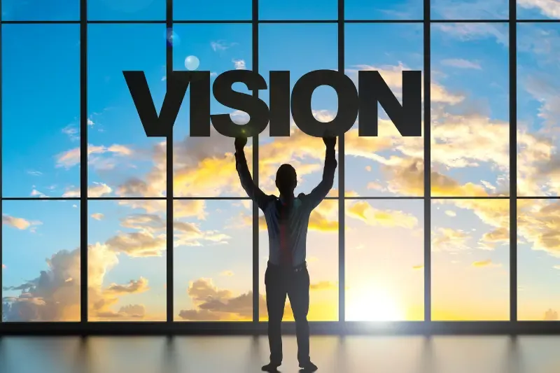vision showing a man holding the word vision