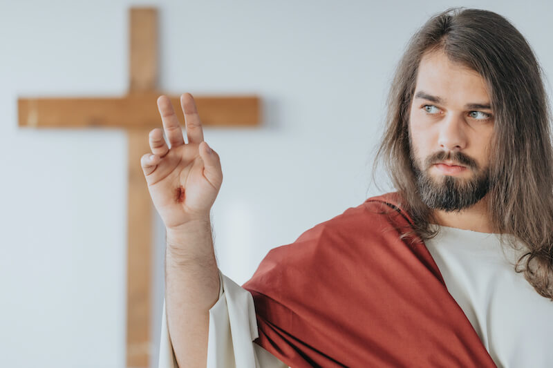 it pleased the LORD to bruise Him showing a picture of Jesus and his pierced hands